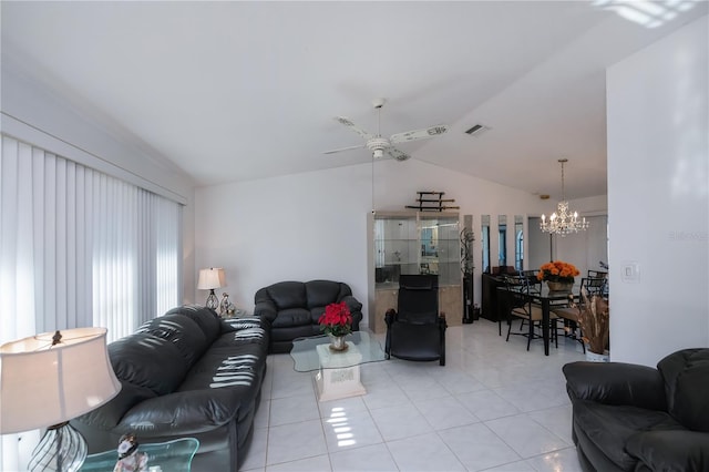 tiled living room featuring ceiling fan with notable chandelier and lofted ceiling