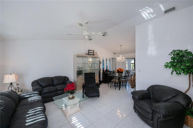 tiled living room featuring ceiling fan with notable chandelier and lofted ceiling