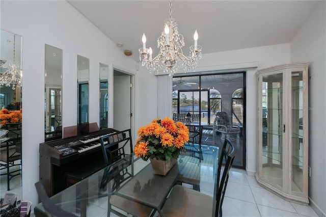 dining room with light tile patterned floors, lofted ceiling, and a notable chandelier