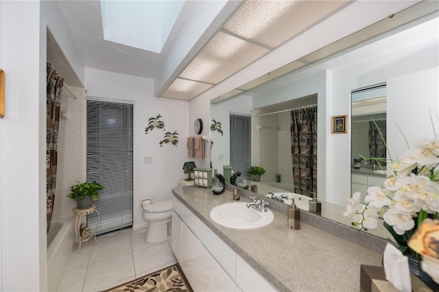 full bathroom with tile patterned flooring, vanity, shower / tub combo, and toilet