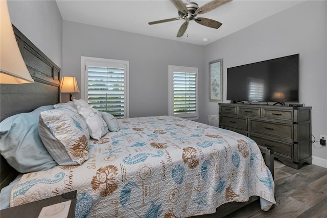 bedroom with ceiling fan and dark hardwood / wood-style floors