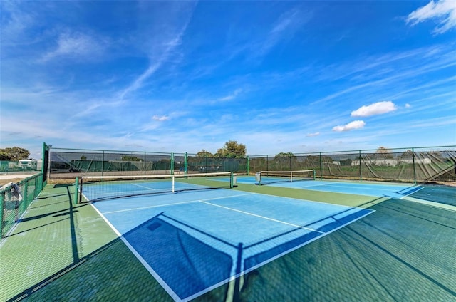 view of sport court with basketball hoop