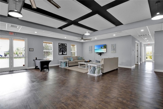 living room with ceiling fan, a healthy amount of sunlight, dark hardwood / wood-style floors, and french doors