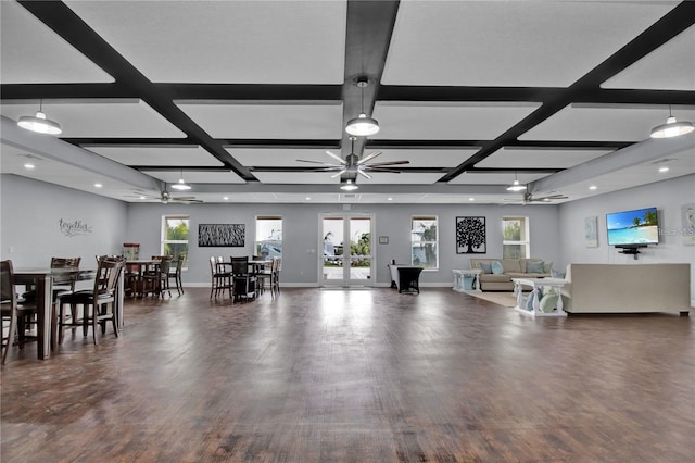 living room with dark hardwood / wood-style floors, a healthy amount of sunlight, and coffered ceiling