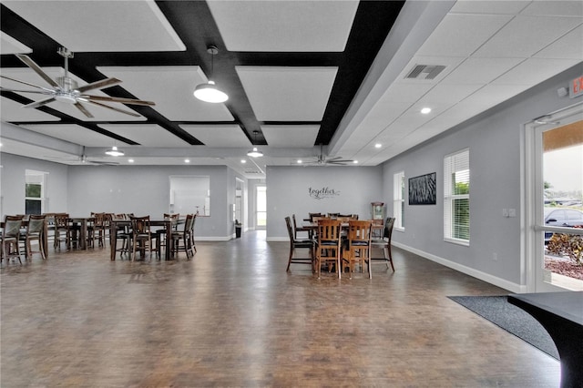 dining area with ceiling fan, dark wood-type flooring, and coffered ceiling