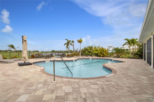 view of swimming pool with a patio area