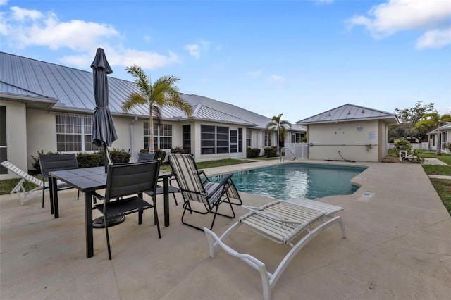 view of pool featuring a patio area