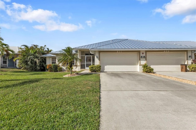 single story home with a garage and a front yard