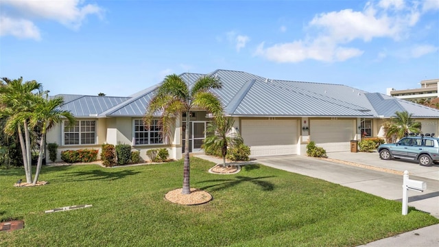 single story home featuring a garage and a front lawn