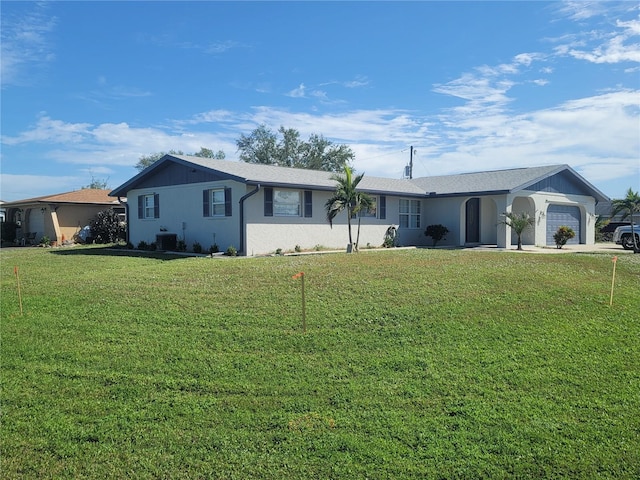 ranch-style house with a front yard and a garage