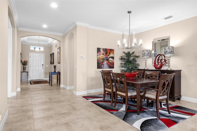 dining room featuring ornamental molding and a chandelier