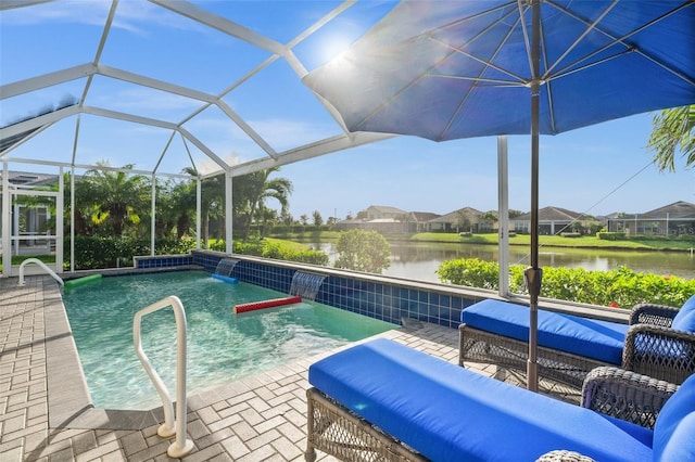 view of pool with pool water feature, a water view, a patio, and a lanai