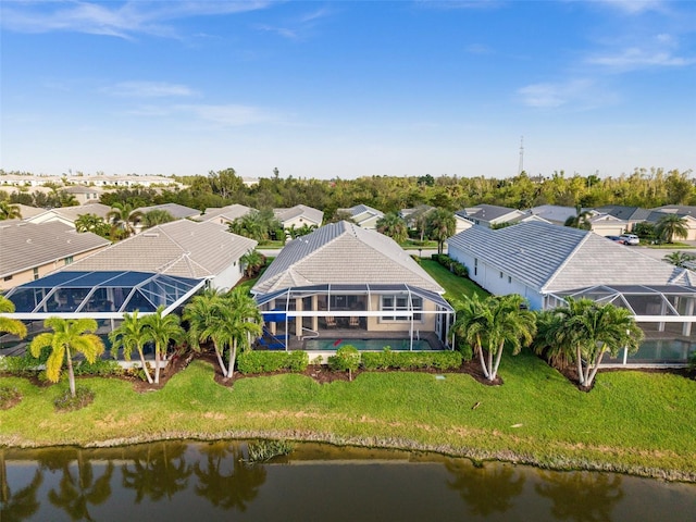 drone / aerial view with a water view