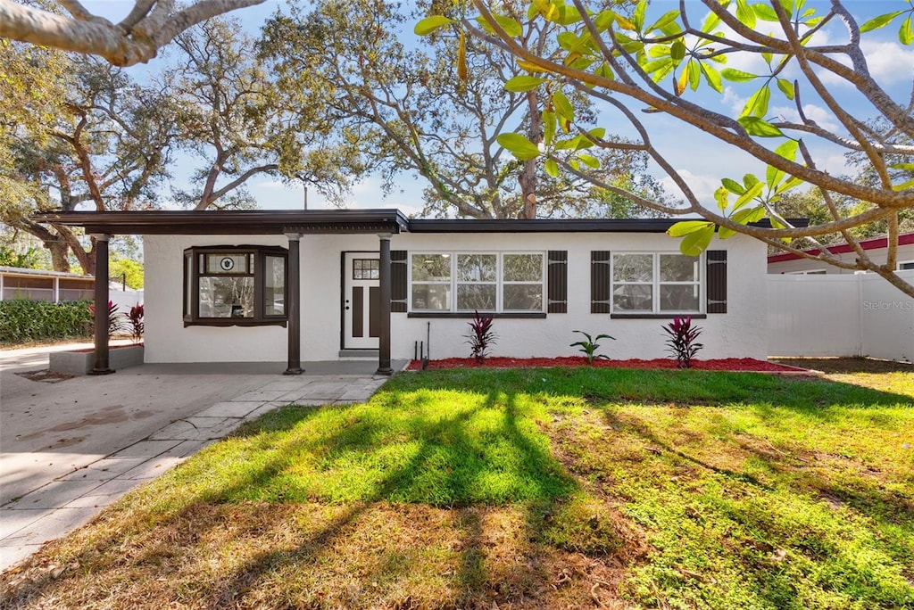 ranch-style house with a front yard