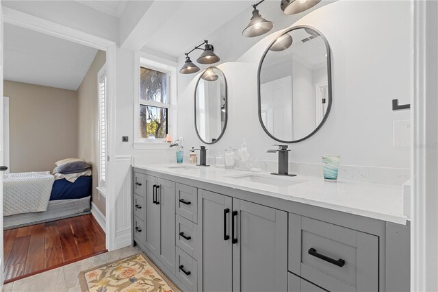12510 Coconut Creek Ct, Fort Myers, FL 33908 - full bathroom featuring ensuite bathroom, double vanity, and wood finished floors