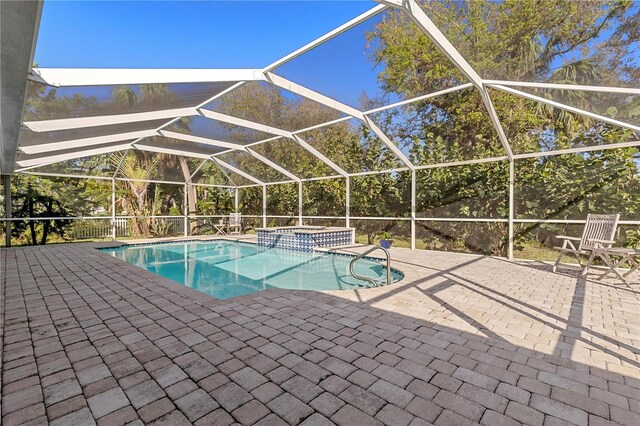12510 Coconut Creek Ct, Fort Myers, FL 33908 - view of swimming pool with a patio area, a pool with connected hot tub, and glass enclosure