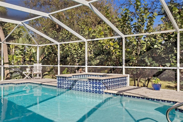 view of swimming pool featuring an in ground hot tub and glass enclosure