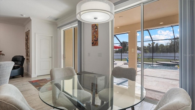 dining area featuring crown molding and light hardwood / wood-style floors