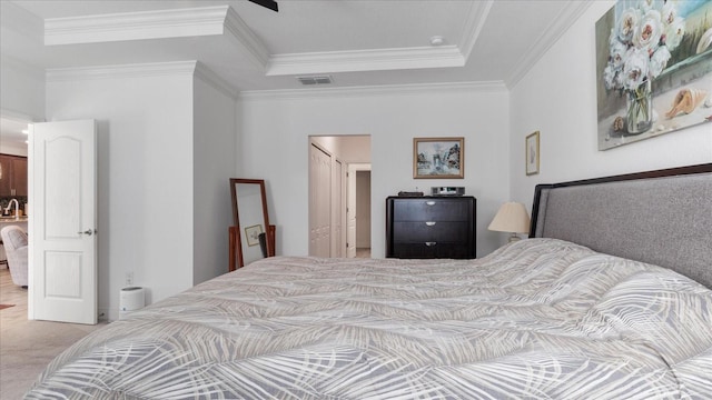 bedroom featuring crown molding and carpet