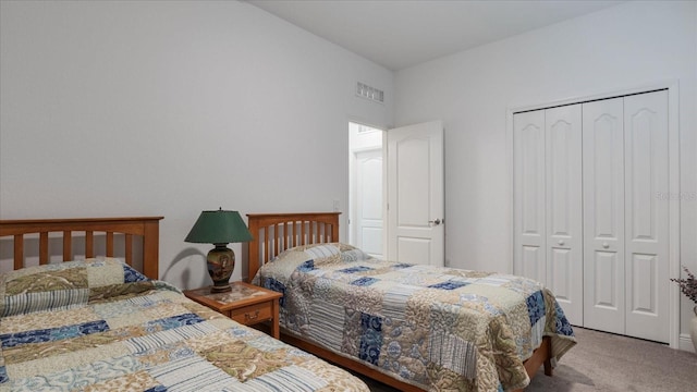 carpeted bedroom with a closet