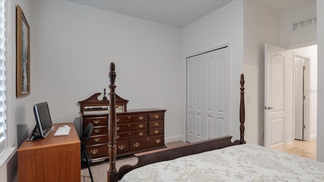 bedroom with a closet and light wood-type flooring