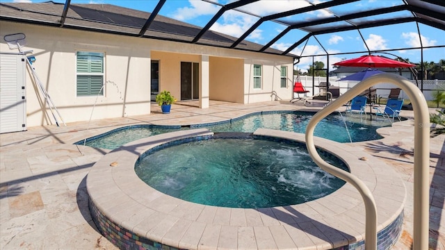 view of swimming pool with glass enclosure, an in ground hot tub, and a patio