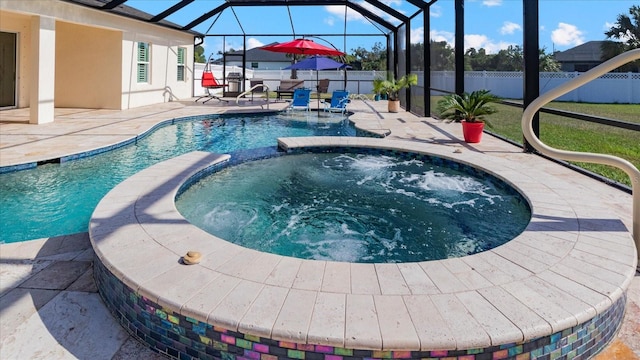 view of swimming pool with a lanai, a patio area, and an in ground hot tub