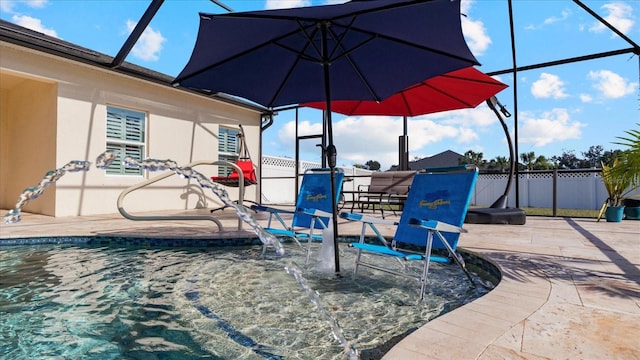 view of patio featuring a lanai, pool water feature, and a fenced in pool