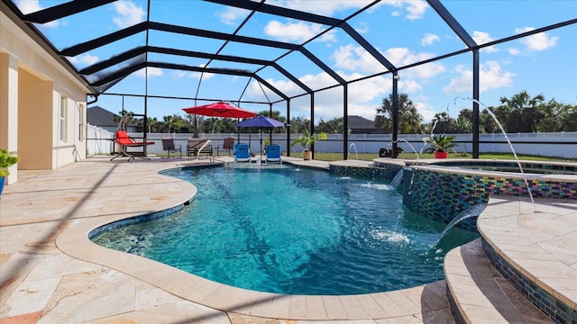 view of pool featuring a lanai, pool water feature, a patio, and an in ground hot tub