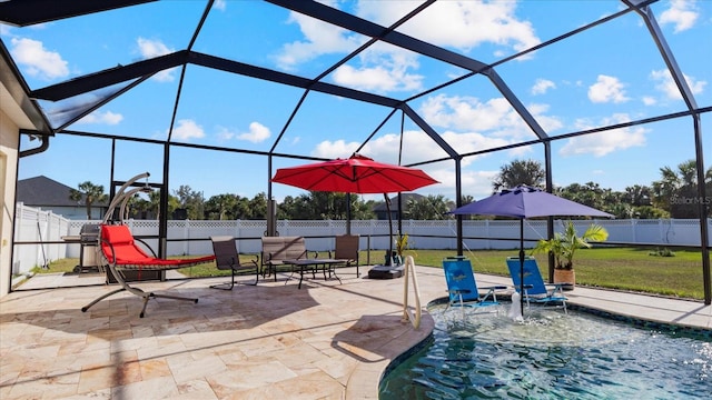 view of patio with a fenced in pool, glass enclosure, and pool water feature