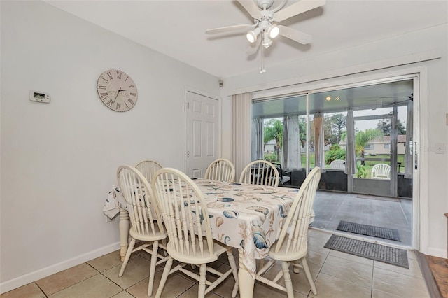 tiled dining area featuring ceiling fan