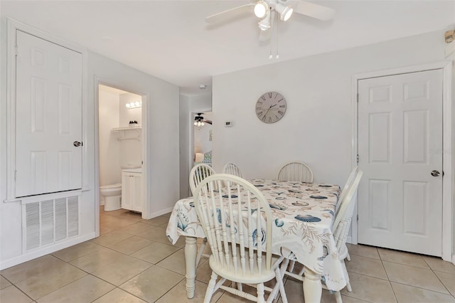 dining room featuring ceiling fan and light tile patterned floors