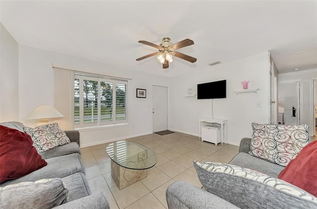 living room featuring light tile patterned floors and ceiling fan