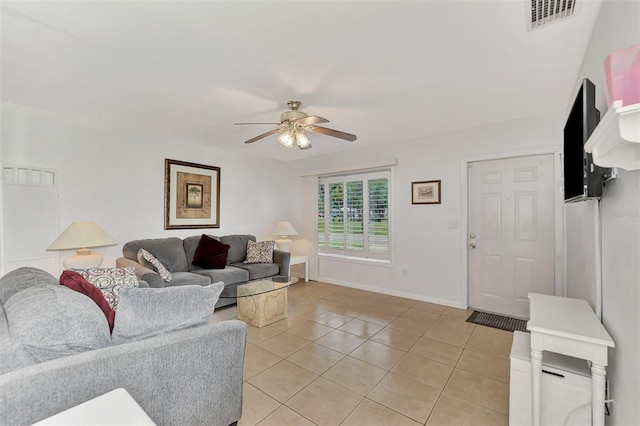 tiled living room with ceiling fan