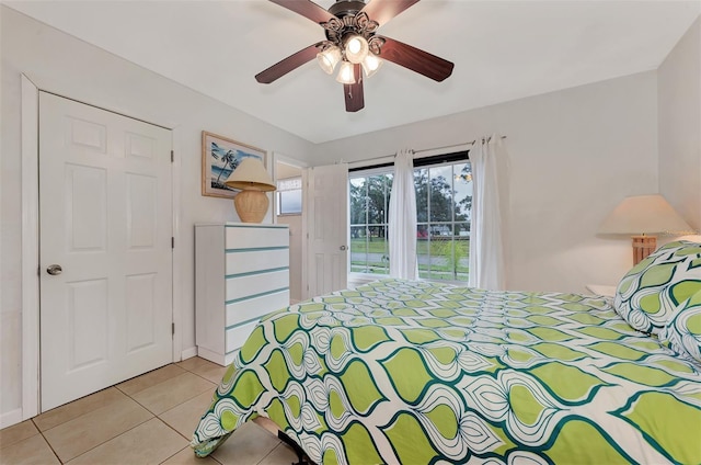 unfurnished bedroom with ceiling fan, access to exterior, and light tile patterned floors