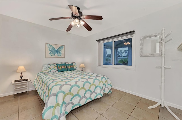 tiled bedroom featuring ceiling fan