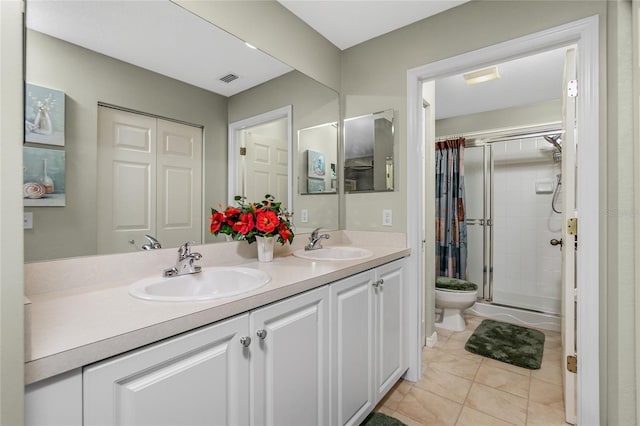 bathroom with curtained shower, tile patterned flooring, vanity, and toilet