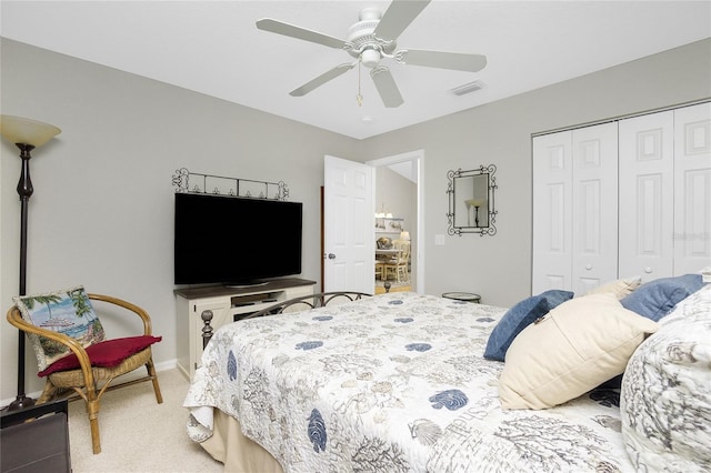 bedroom with carpet flooring, a closet, and ceiling fan