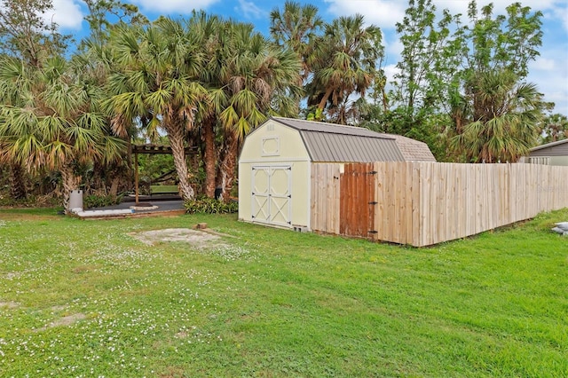 view of outdoor structure featuring a lawn