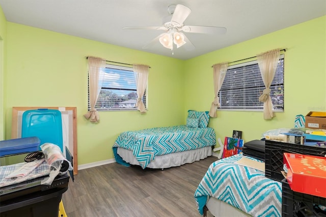 bedroom featuring hardwood / wood-style floors and ceiling fan