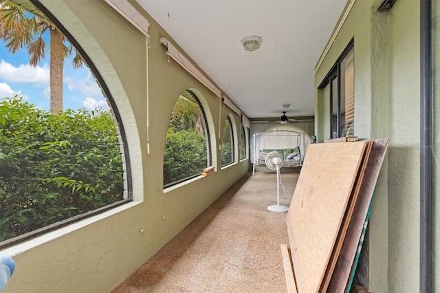 interior space with a healthy amount of sunlight and light carpet