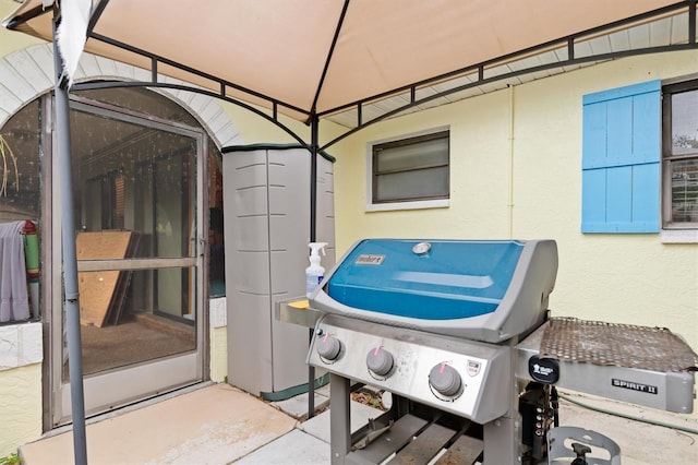 exterior space featuring a gazebo and grilling area