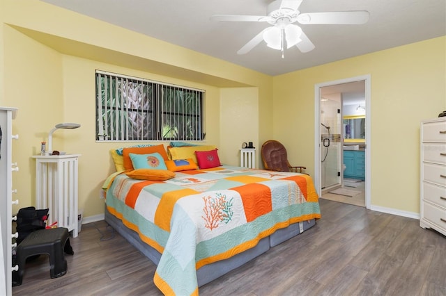 bedroom with ensuite bath, ceiling fan, and hardwood / wood-style flooring