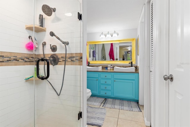 4290 Randypaar St, Port Charlotte, FL 33948 - bathroom featuring a shower stall, vanity, tile patterned flooring, and a closet