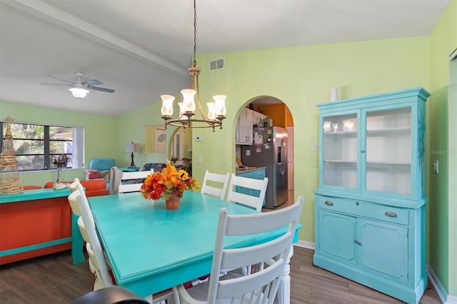 4290 Randypaar St, Port Charlotte, FL 33948 - dining area featuring arched walkways, wood finished floors, a chandelier, ceiling fan, and beam ceiling