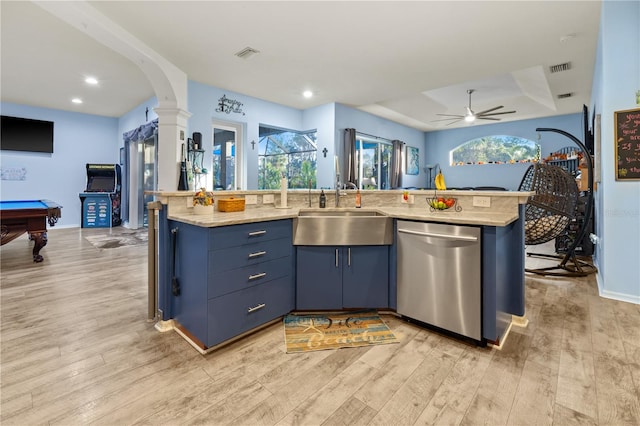 kitchen with dishwasher, light hardwood / wood-style floors, blue cabinets, and sink