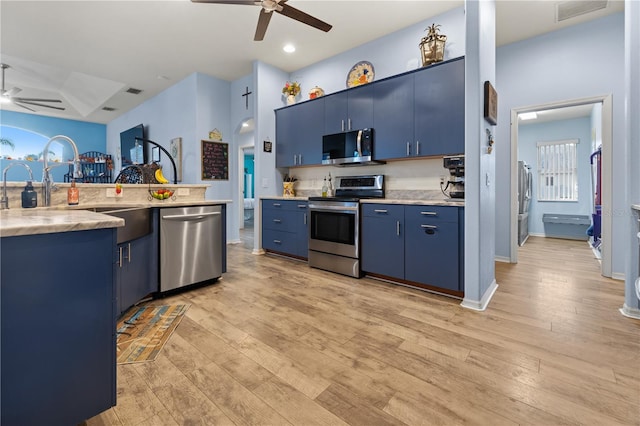 kitchen featuring blue cabinetry, stainless steel appliances, light hardwood / wood-style flooring, and ceiling fan