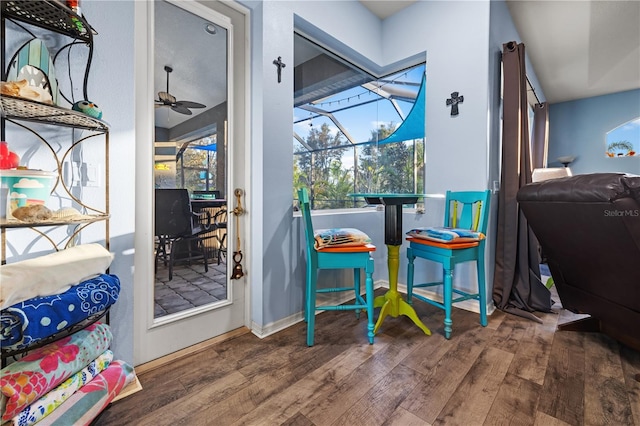 interior space with wood-type flooring and ceiling fan