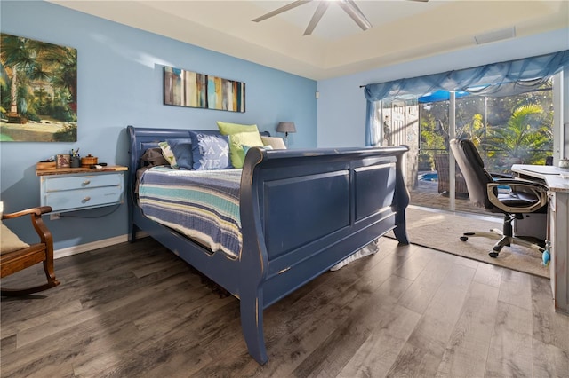 bedroom with dark hardwood / wood-style floors, multiple windows, and ceiling fan