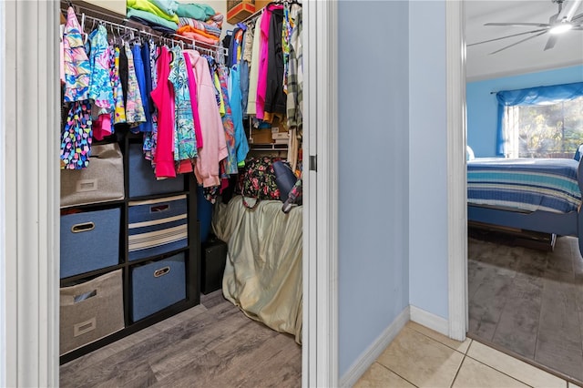 spacious closet with ceiling fan and wood-type flooring